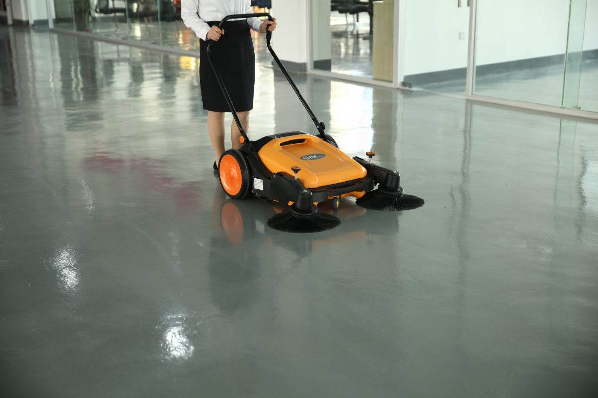 TYR manual walk-behind sweeper machine cleaning glossy office epoxy floor